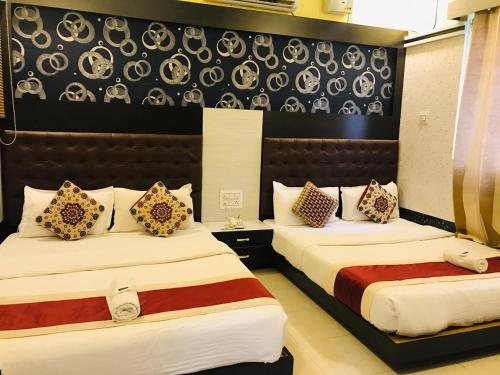 Hotel Royal Inn Mangalore - Opp SDM Law College MG Road客房内的一张或多张床位