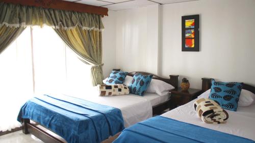 Hotel El Jerarca客房内的一张或多张床位