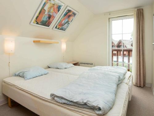 Three-Bedroom Holiday home in Rømø 5客房内的一张或多张床位