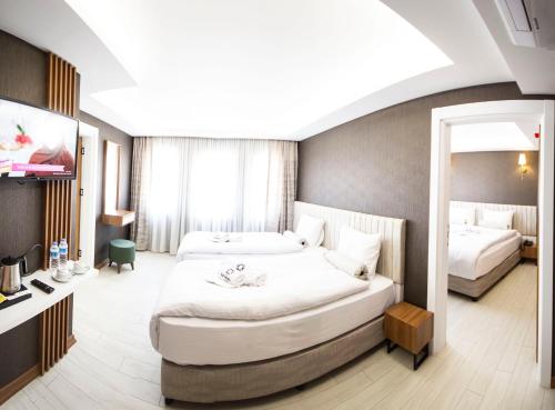 KAR BEYAZ HOTEL BURSA客房内的一张或多张床位