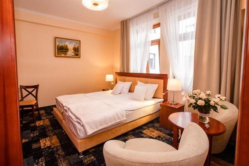胡博图斯热舒夫酒店客房内的一张或多张床位