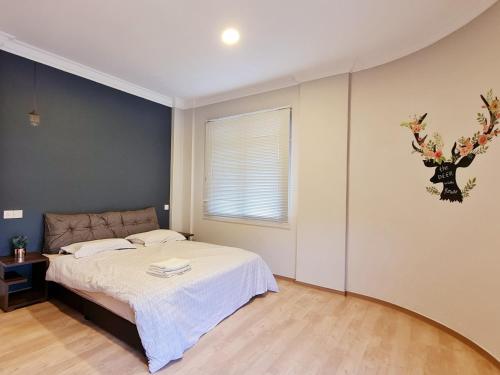 The DEER Kuching 4 bedrooms Apartment客房内的一张或多张床位