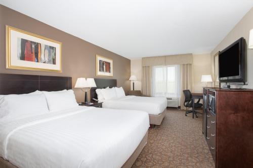 美国肯考迪亚81号智选假日套房酒店客房内的一张或多张床位