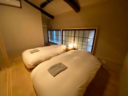 CAMPTON Higashiyama Roku客房内的一张或多张床位