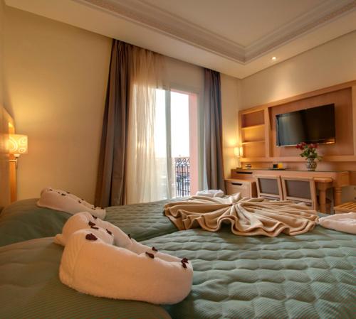 阿尔巴亚宫殿酒店客房内的一张或多张床位
