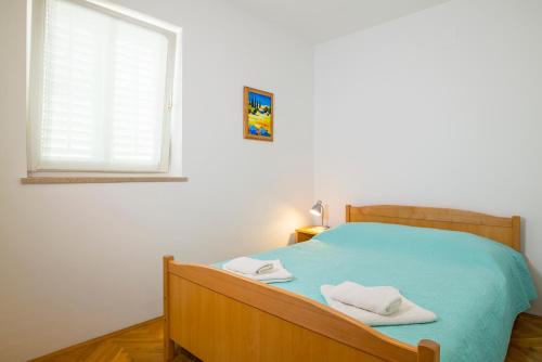 Seaview Apartment Bojan Rabac客房内的一张或多张床位
