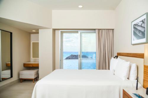 Emporio Cancun - Optional All Inclusive客房内的一张或多张床位