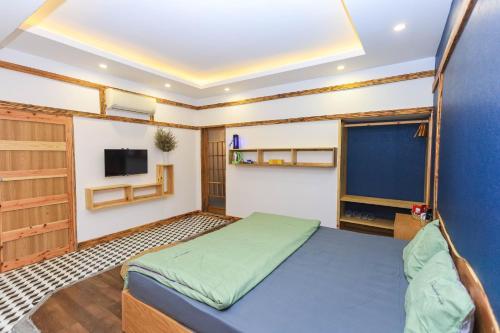 HomeStay Võ Thị Yến客房内的一张或多张床位