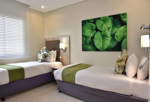 La Lucia Sands Beach Resort客房内的一张或多张床位
