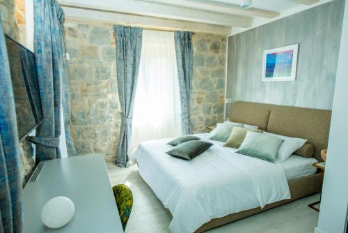 Heritage Villa Vitturi Sea View客房内的一张或多张床位