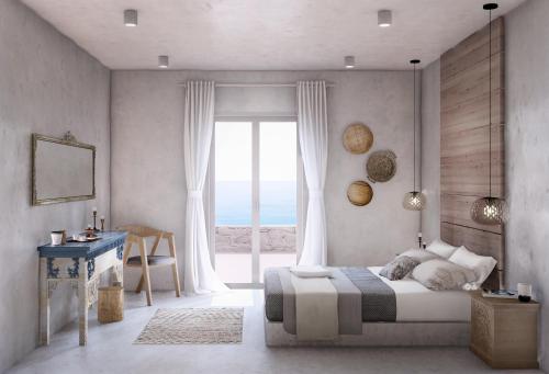 布拉卡Mirabelle Luxury Villas的一间卧室设有一张床和一个大窗户