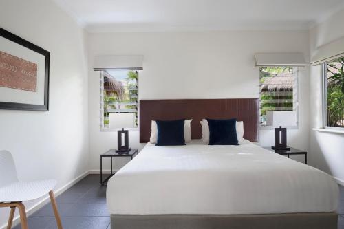 布鲁姆弗兰吉帕尼曼特拉公寓式酒店客房内的一张或多张床位