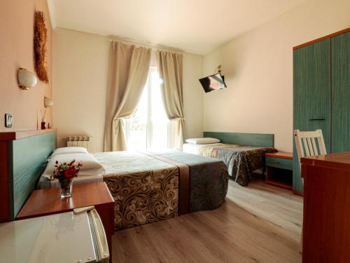 Hotel Zeno客房内的一张或多张床位