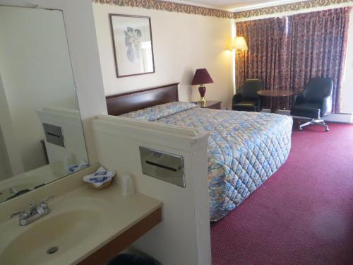 特维乐汽车旅馆客房内的一张或多张床位
