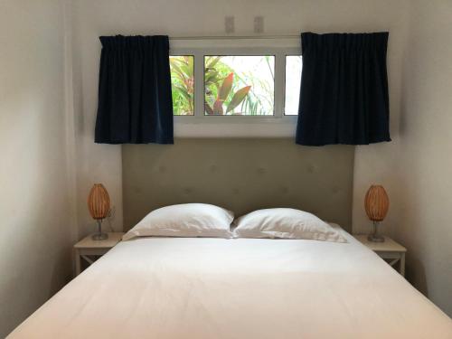 帕拉马里博荷兰小屋酒店客房内的一张或多张床位