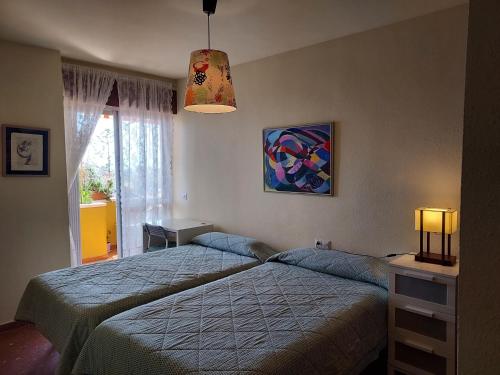 Pedregalejo Room客房内的一张或多张床位