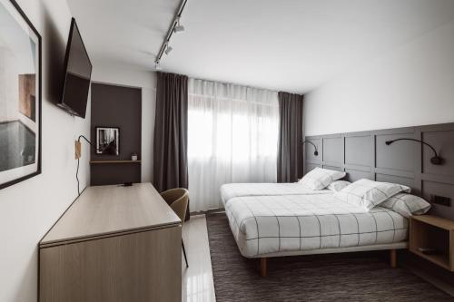 Chamberí Suites客房内的一张或多张床位