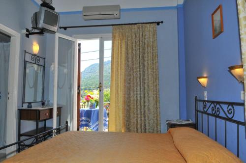 Oasis Hotel Theodoros & Litsa Galaris客房内的一张或多张床位