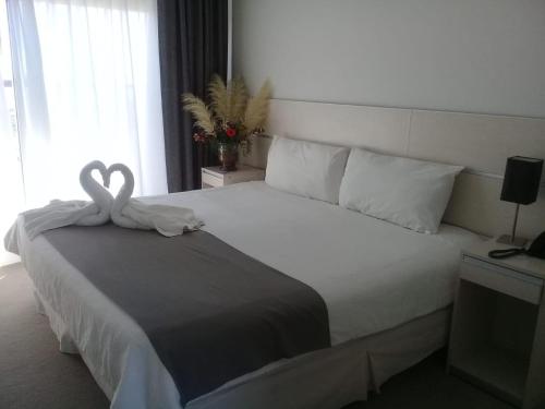 Hotel UNL-ATE客房内的一张或多张床位