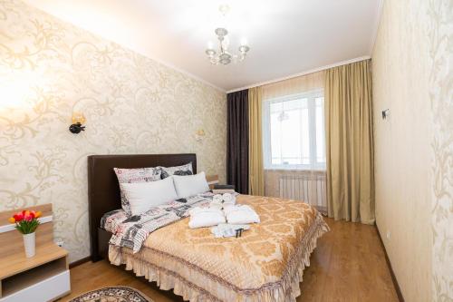 В Promenade Expo квартира с романтическим видом客房内的一张或多张床位