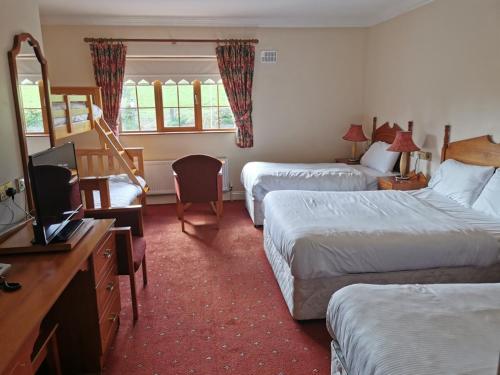 Rhu Glenn Hotel客房内的一张或多张床位