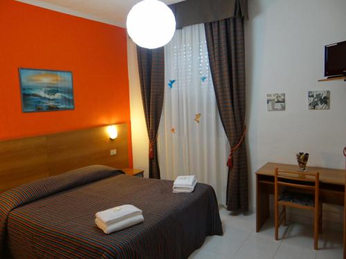 阿曼多拉菲耶拉酒店客房内的一张或多张床位