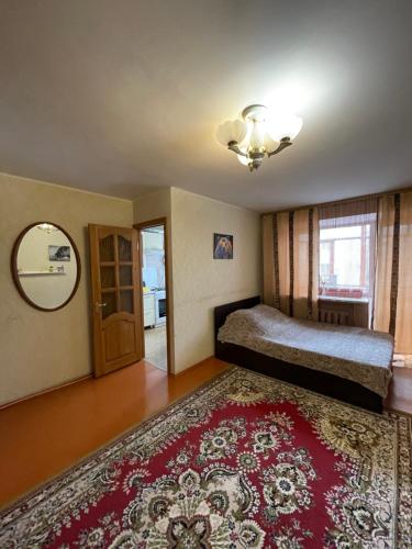 Apartments ROMAYA Economy class客房内的一张或多张床位