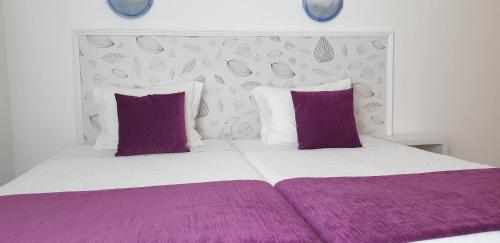 Hotel Palmeira客房内的一张或多张床位