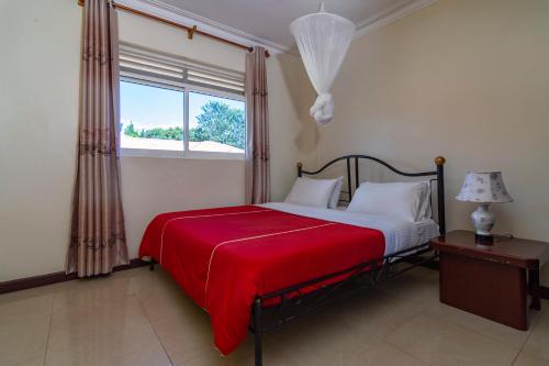 Karibu BB Suites客房内的一张或多张床位