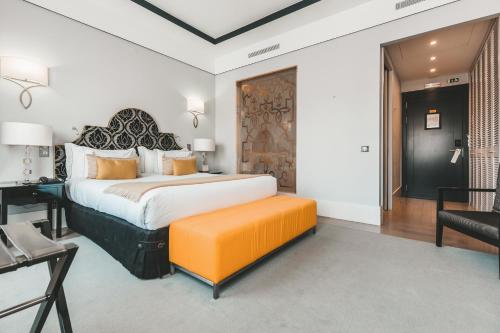 世界小型豪华酒店之阿连特茹马莫里Spa酒店客房内的一张或多张床位