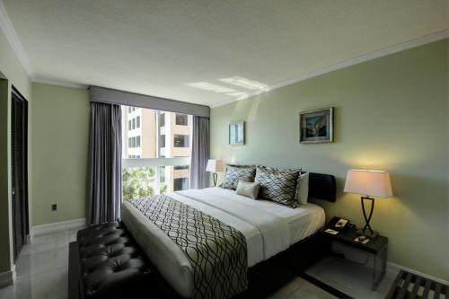 慕缇旎豪华套房酒店客房内的一张或多张床位