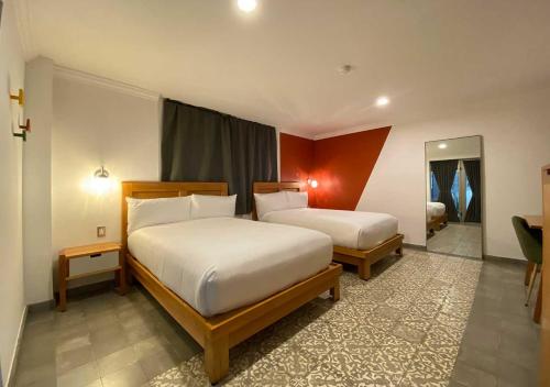 Hotel MX condesa客房内的一张或多张床位