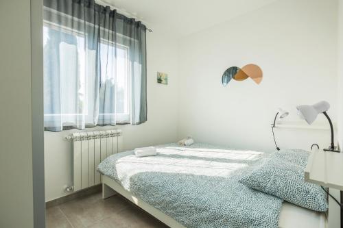 Apartaments Punta Relax客房内的一张或多张床位