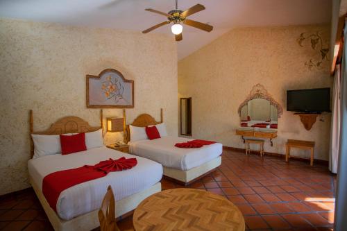 Hosteria Las Quintas Hotel Restaurante Bar客房内的一张或多张床位