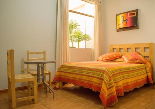 Takora Inn客房内的一张或多张床位