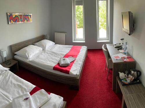 奥林匹亚酒店客房内的一张或多张床位