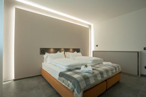 Ca' de L'Olif - Holiday Clima Apartments客房内的一张或多张床位