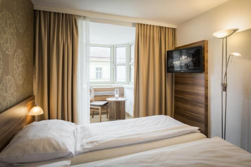Hotel Enziana Wien客房内的一张或多张床位
