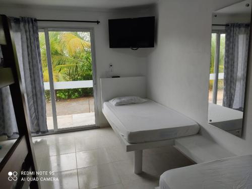 cabañas del caribe La Bonga客房内的一张或多张床位