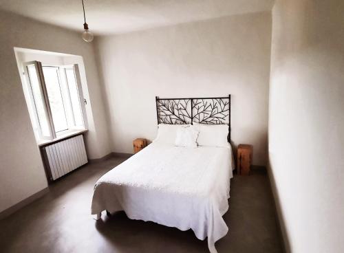 La casa di Montegiardino客房内的一张或多张床位