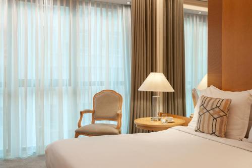 雅典美利亚酒店客房内的一张或多张床位