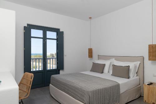 Archon Seaside Retreat客房内的一张或多张床位