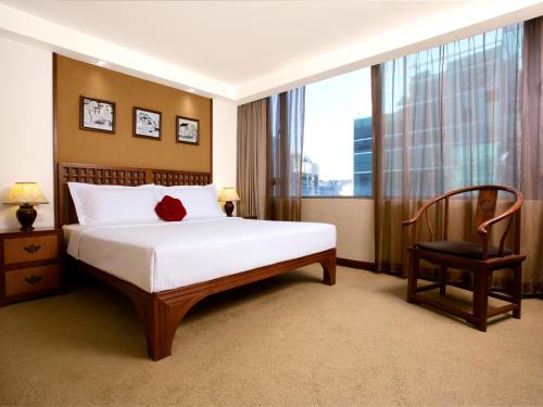 晋逸精品酒店 中环客房内的一张或多张床位