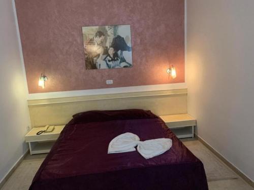 Hotel Tunisie Confort客房内的一张或多张床位