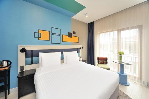 Stayso by Cloud7 Hotels客房内的一张或多张床位