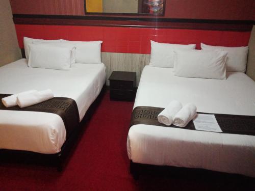 HOTEL SRI IMPIAN客房内的一张或多张床位