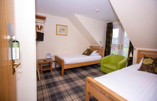 Braeside Guest House, Loch Lomond客房内的一张或多张床位
