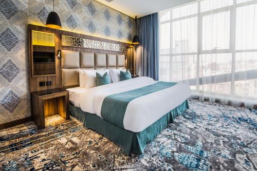 White Diamond Hotel - Al Nuzha客房内的一张或多张床位