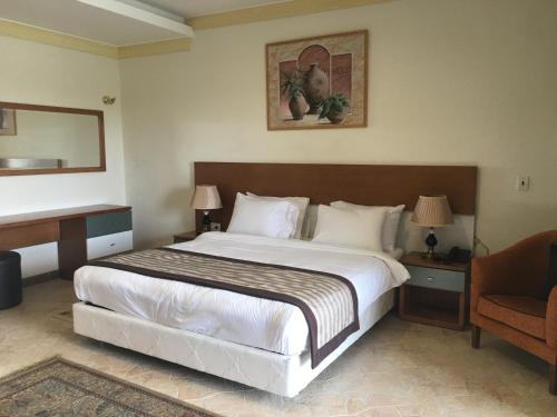 Tolip El Fairouz Hotel客房内的一张或多张床位