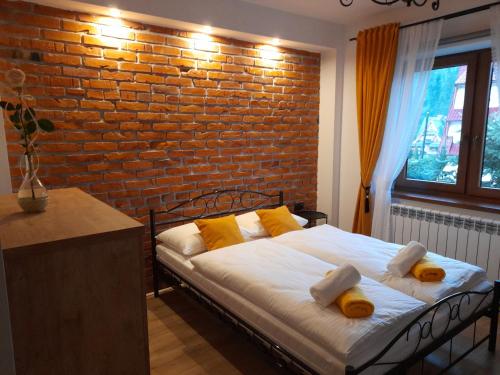 Dom Wypoczynkowy NATALIA客房内的一张或多张床位